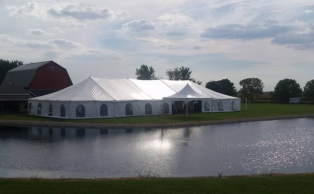 40 ft. x 100 ft. Skyline Classic Pole near pond and old barn